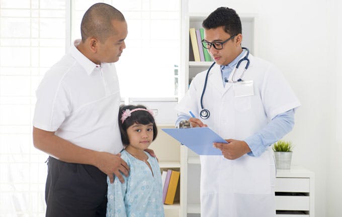 Doctor Talking To Patient In Office Doctor Talking To Patient In Office