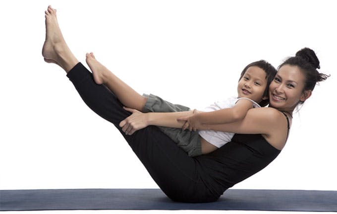 Mother and son in yoga pose Mother and son in yoga pose