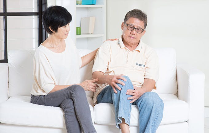 Senior experiencing knee pain Senior experiencing knee pain