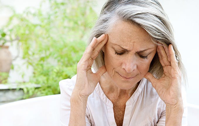 Mature Woman Touching Her Head With Her Hands Mature Woman Touching Her Head With Her Hands