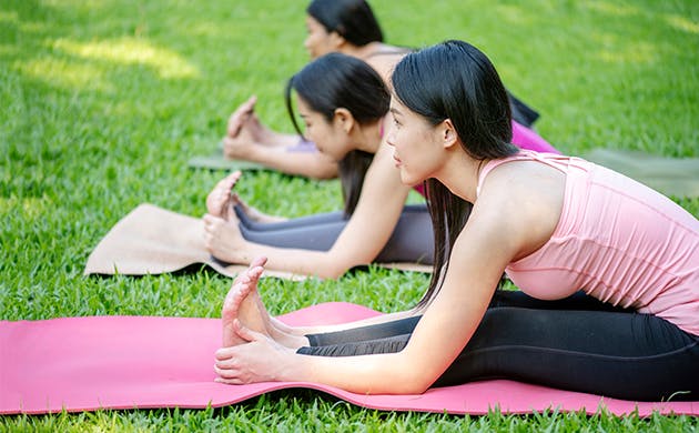 Hispanic Women Practicing The Cobra Pose During A Yoga Class Hispanic Women Practicing The Cobra Pose During A Yoga Class