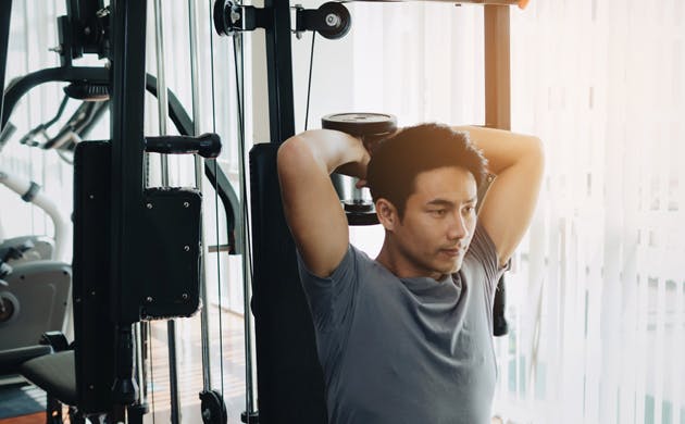 Man doing weights in gym Man doing weights in gym