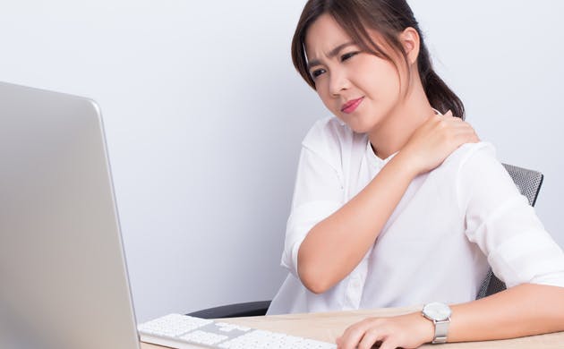 Office worker experiencing headache Office worker experiencing headache
