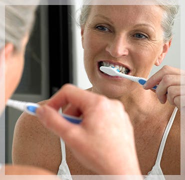 Elderly Woman Brushing Teeth Plaque Build Up parodontax Elderly Woman Brushing Teeth Plaque Build Up parodontax