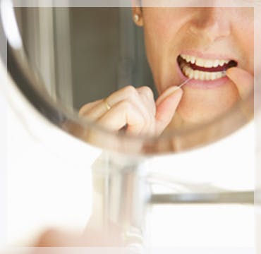Flossing Teeth In Mirror Flossing Teeth In Mirror