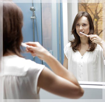 Woman Brushing Teeth Treating Gum Disease parodontax Woman Brushing Teeth Treating Gum Disease parodontax