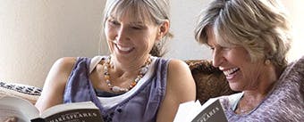 Getting dentures header image Woman getting closer to others