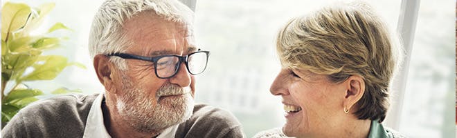 Smoking and dentures header image woman and man up close to each other