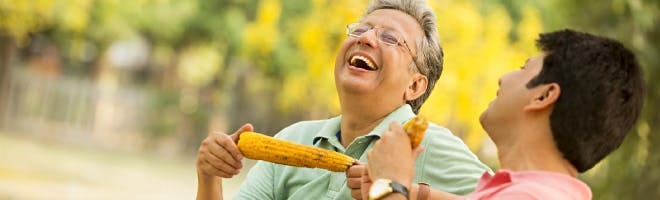 Staying confident with dentures header image Woman and man up close to each other