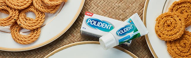 Food denture wearers should be wary of header image woman laughing with friends