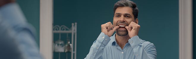 How to make dentures fit comfortably header image woman eating food