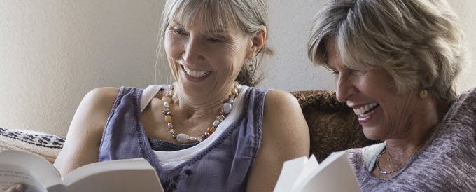 getting dentures header image woman getting closer to others