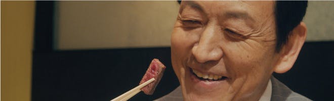 Why it is important to use an adhesive header image Woman eating food
