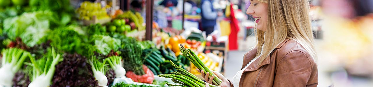 Woman with a White Smile Picking Vegetables Header Woman with a White Smile Picking Vegetables Header
