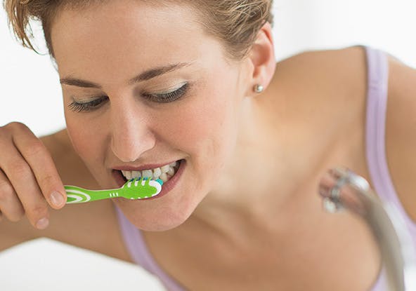 Woman brushing her teeth Woman brushing her teeth