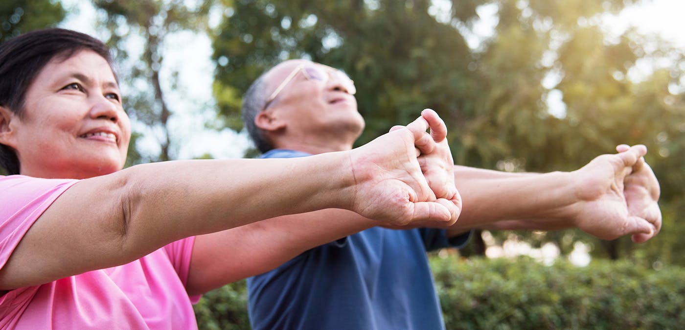 Person holding wrist in pain