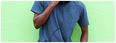 Young man wearing a baggy blue t-shirt Young man wearing a baggy blue t-shirt