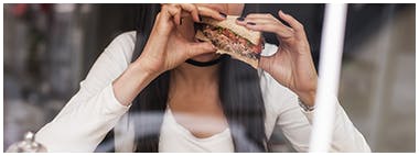 Young woman eating a healthy sandwich Young woman eating a healthy sandwich