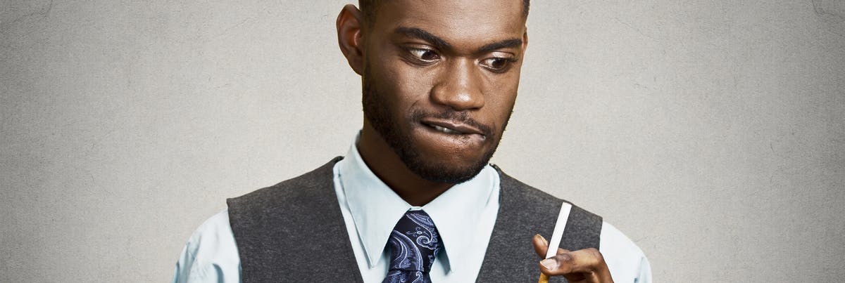 Man contemplating smoking Man contemplating smoking